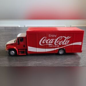 Collection of vintage Coca Cola truck memorabilia